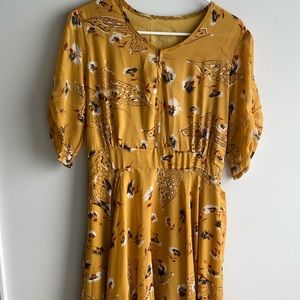 Yellow floral midi dress.